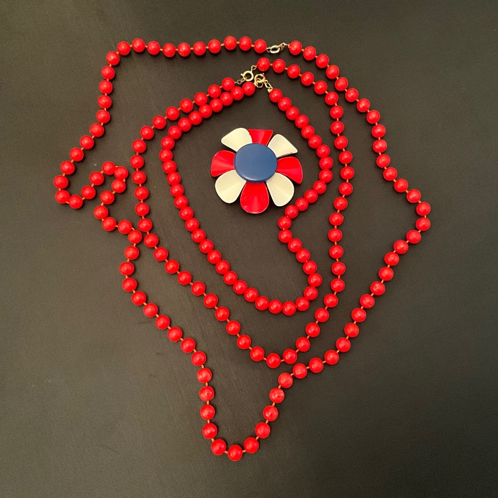 Three Red Beaded Necklaces and One Red, White and Blue Metal Brooch